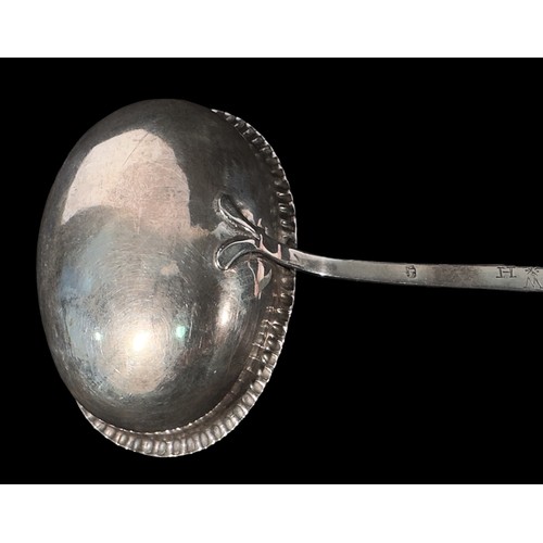 77 - A George III silver toddy ladle by Thomas Morley, the bowl with crimped edge and with twisted baleen... 