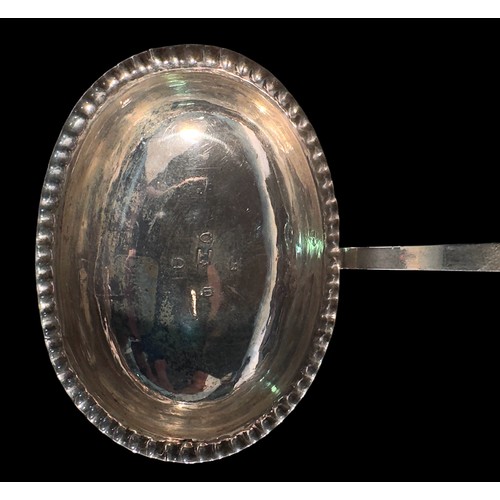 77 - A George III silver toddy ladle by Thomas Morley, the bowl with crimped edge and with twisted baleen... 