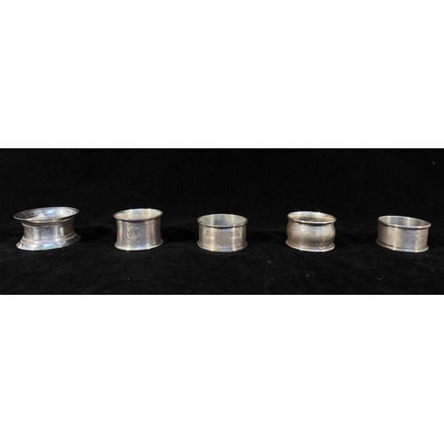 79 - A collection of twenty various silver napkin rings, gross weight approximately 12.05ozt