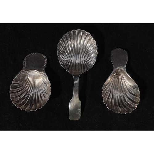 90 - Three various silver caddy spoons, each with shell shaped bowls, including a George III example by T... 