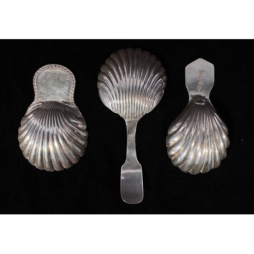 90 - Three various silver caddy spoons, each with shell shaped bowls, including a George III example by T... 