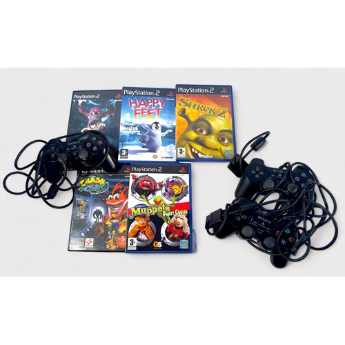 430 - A boxed Sony PlayStation 2, Charcoal Black, with three wired controllers and fifteen various games, ... 