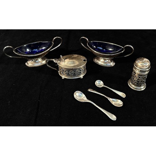 101 - Four various silver salts with fitted blue glass liners, to include, a pair of Victorian oval twin-h... 