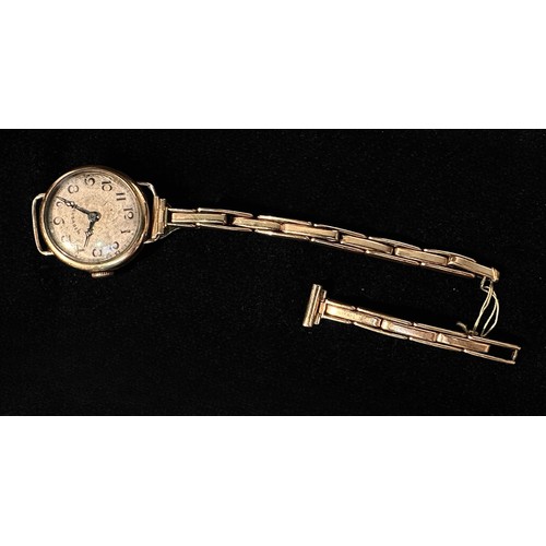 140 - A ladies vintage 9ct gold cased wristwatch, the silvered dial inscribed ‘Crusader’ and with Arabic n... 