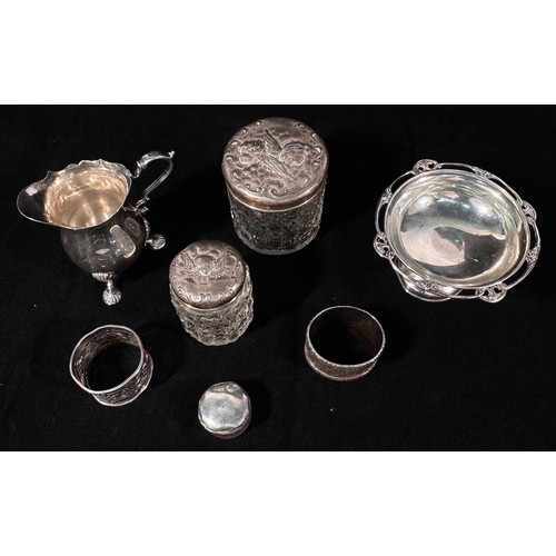 102 - A collection of assorted silver comprising, a silver tazza with applied Art Nouveau-style scrolled f... 