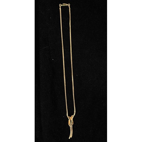 171 - A 14K gold necklace, of flat snake-link type with ribbon-loop pendant and open ends, sliding spring ... 