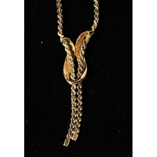 171 - A 14K gold necklace, of flat snake-link type with ribbon-loop pendant and open ends, sliding spring ... 