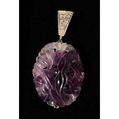 169 - A pair of amethyst and diamond earrings, each carved a five-petal flower, claw-set to the centre wit... 