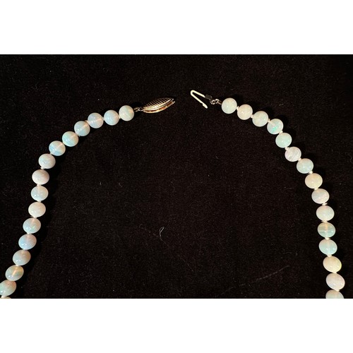 166 - An Opal bead necklace, 7mm-6mm beads, 45cm long, 14k eliptical gold spring-hook safety clasp.