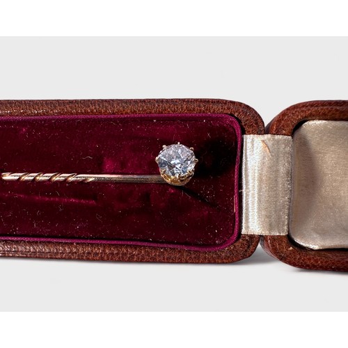 174 - An early 20th century solitaire diamond stick pin, eight-claw set with a round brilliant cut diamond... 