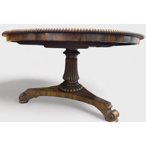 613 - A William IV rosewood breakfast table, the circular tilt-top with beaded edge and brass locking mech... 