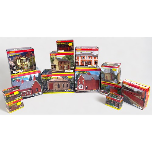 444 - A collection of thirteen assorted boxed Hornby Skaledale model railway layout buildings, including, ... 