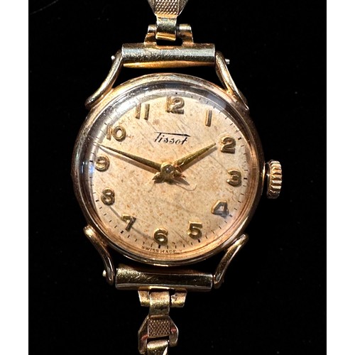 139 - A 9ct gold cased ladies Tissot wristwatch, the silvered dial with Arabic numerals denoting hours, on... 