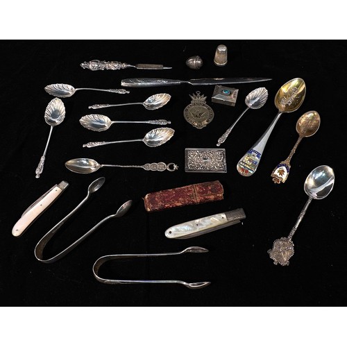 103 - A collection of assorted silver items, comprising, various silver apostle and souvenir spoons, inclu... 