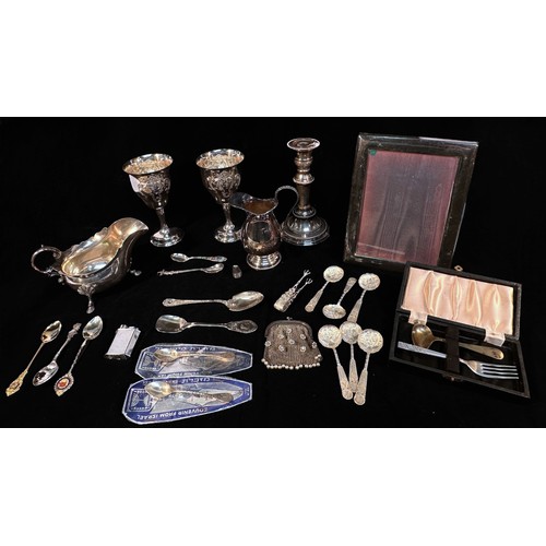 103 - A collection of assorted silver items, comprising, various silver apostle and souvenir spoons, inclu... 