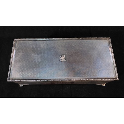 109 - A silver cigarette box by John Rose, of rectangular form, with engine turned decoration an applied p... 