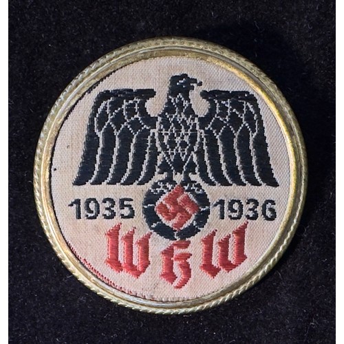 529 - A Winterhilfswerke (WHW) 1935-1936 badge, inscribed to back 'Dr. R. Morisse & Co. 'Wuppertal'. 3cm d... 