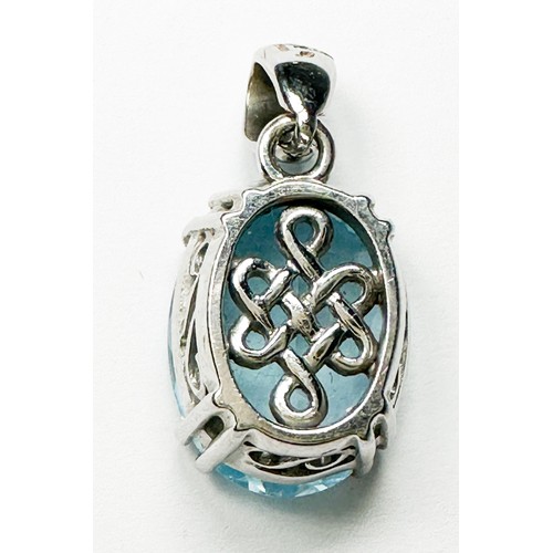 227 - An 18ct white gold pendant, set with an oval faceted blue topaz, measuring 15mm x 11mm, suspended on... 