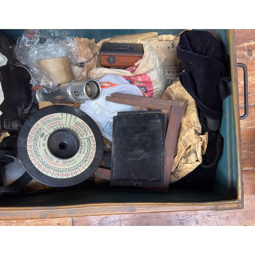 494 - A metal trunk containing various box camera peripherals, including The Westminster Photographic Exch... 