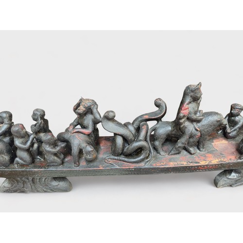 346 - A carved hardwood altarpiece, possibly South American, modelled as a stylised boat with figures and ... 