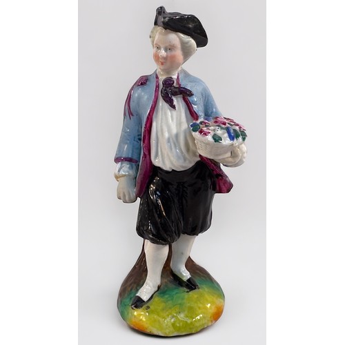 45 - An 18th century Bow Porcelain Figure of a young man emblematic of Spring and holding a basket of flo... 