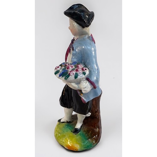 45 - An 18th century Bow Porcelain Figure of a young man emblematic of Spring and holding a basket of flo... 