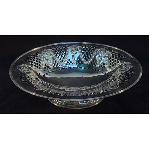 111 - A late Victorian silver bread basket, of oval form with embossed patera, drapped swags, pierced trel... 