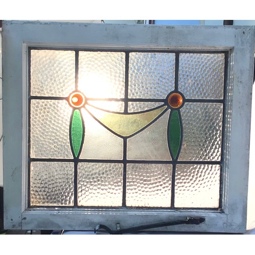 46 - Five pieces of Edwardian stained glass panels all set in a pine window frame, 2 x 50 x 50cm and 3 x ... 