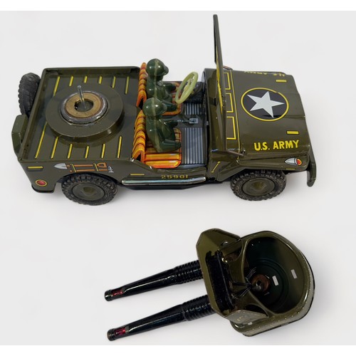 463 - A 1960s Japanese tin-plate battery operated Anti-Aircraft Jeep by Okuma, together with a Jimson fric... 