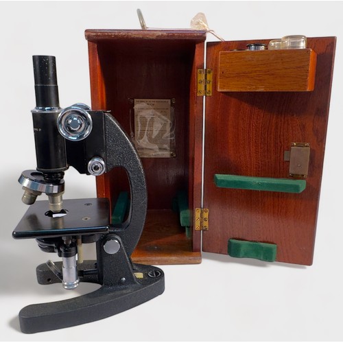 496 - A vintage Cooke, Troughton & Simms Ltd York, England, monocular microscope with black lacquered body... 