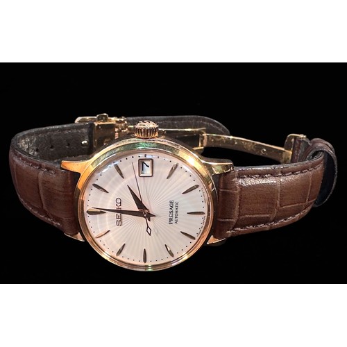 141 - A gents gold-plated Seiko ‘Presage’ automatic wristwatch, the white textured dial with applied baton... 