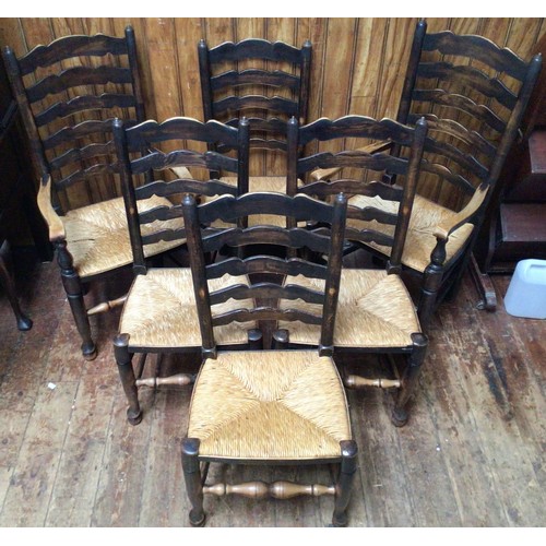 615 - A set of six 19th Century oak and rush seated ladder back dining chairs, raised on tapering legs to ... 