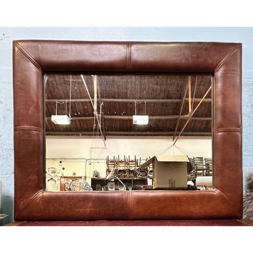 524 - A large modern brown leather framed rectangular mirror, 68cm x 89cm