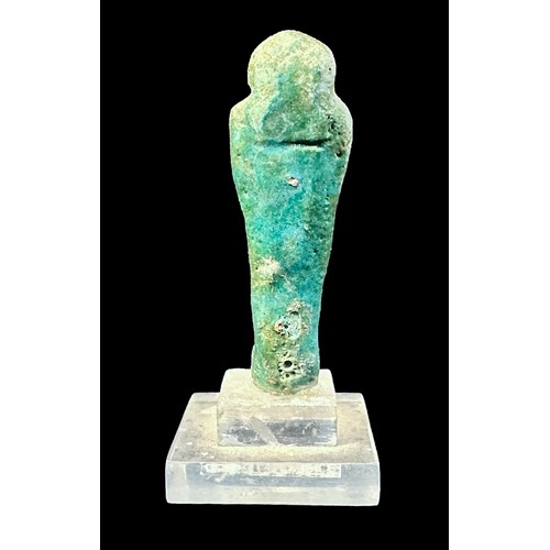 361 - An Egyptian turquoise glazed pottery Shabti figure, raised on stepped clear acrylic base, 9cm tall i... 