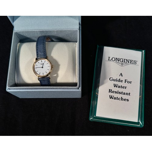 150 - A ladies gold-plated Longines wristwatch, model L41372, the white enamel dial with applied gilt bato... 