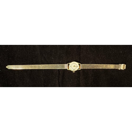 152 - An 18ct gold cased ladies wristwatch by Roamer, the silvered dial with batons denoting hours, on gol... 