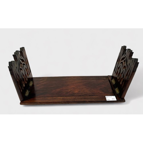 372 - A Gothic Revival-style rosewood extending book slide, with shaped and pierced ends, together with a ... 