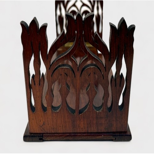 372 - A Gothic Revival-style rosewood extending book slide, with shaped and pierced ends, together with a ... 