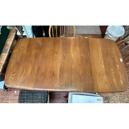 607 - An Ercol blonde elm drop-leaf dining table, model 383, raised on squared, tapering supports, 136cm l... 