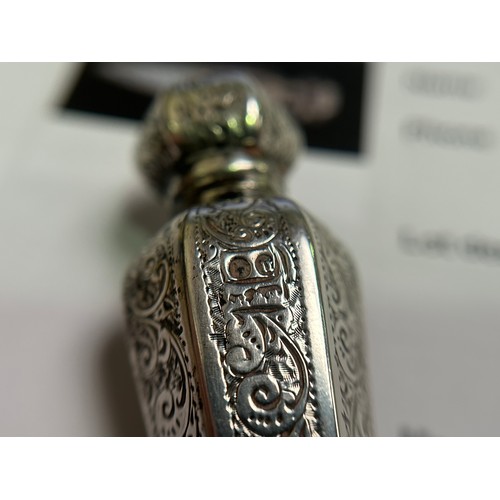 350 - A Victorian silver perfume bottle, of hexagonal tapering form with foliate engraved panels, vacant c... 