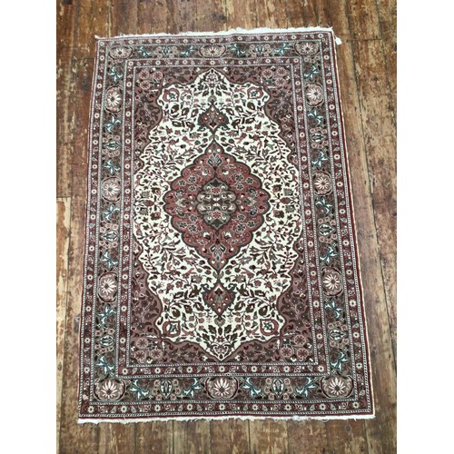 527 - A Persian design hand-knotted medallion rug with Shah Abbas floral border and all-over stylized foli... 