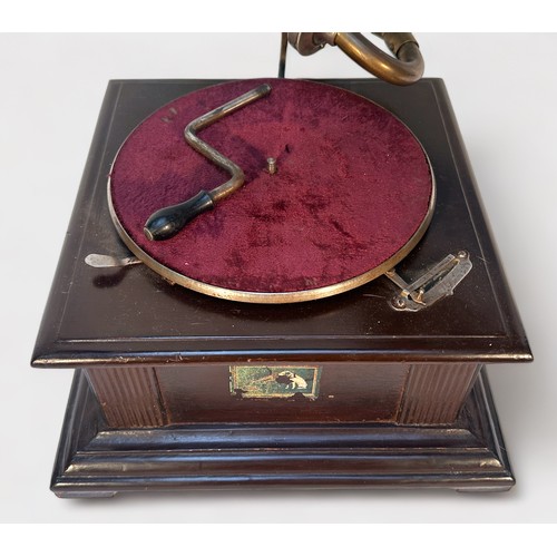 327 - A stained wooden His Masters Voice gramophone, with brass horn, together with eight Elvis Presley 78... 