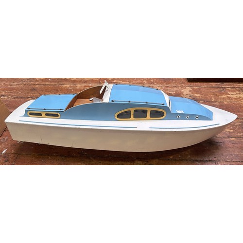 458 - An Aerokits 'Sea Queen' cabin cruiser model boat, fitted with motor, blue and white, 118cm long