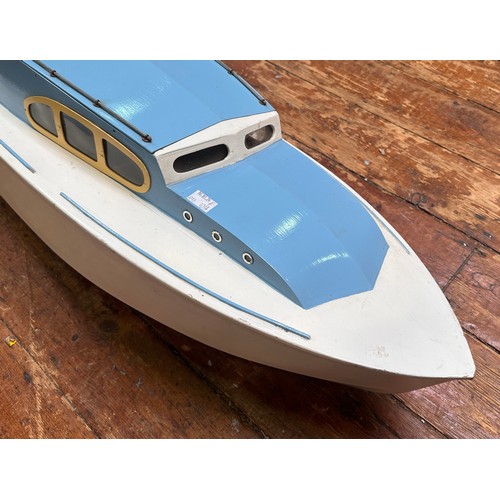 458 - An Aerokits 'Sea Queen' cabin cruiser model boat, fitted with motor, blue and white, 118cm long