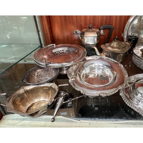 82 - Various silver-plated tablewares including two various covered tureens, pierced baskets and dishes, ... 