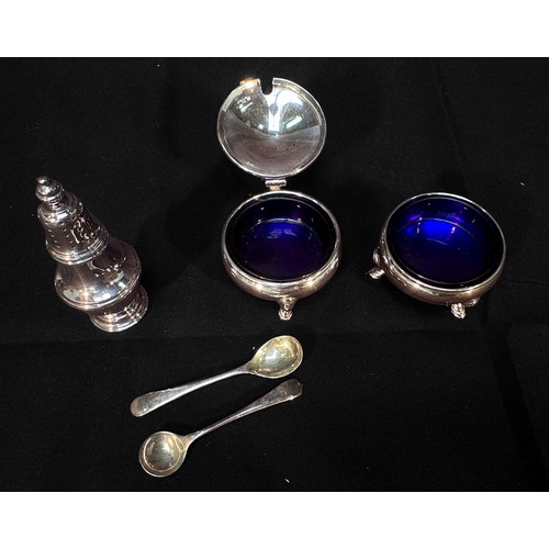 86 - A Three-piece silver condiment set of open circular salt, mustard with hinged cover and a baluster p... 