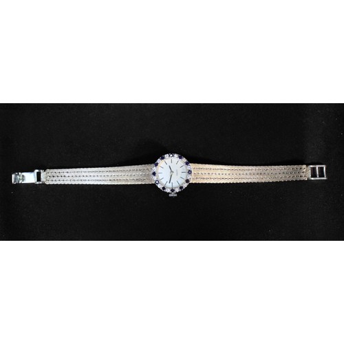 115 - A ladies 9ct white gold wristwatch by Roamer, the silvered dial with batons denoting hours, the beze... 