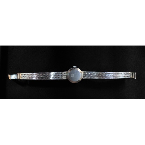 115 - A ladies 9ct white gold wristwatch by Roamer, the silvered dial with batons denoting hours, the beze... 