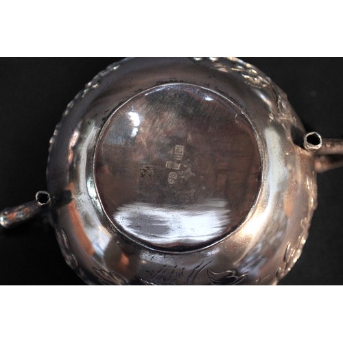 52 - A Chinese Export three-piece white-metal teaset, (tests as .800 silver or higher), of globular form ... 