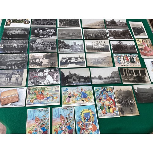 304 - A quantity of modern postcards, loose and in three photo albums; but more interesting vintage greeti... 